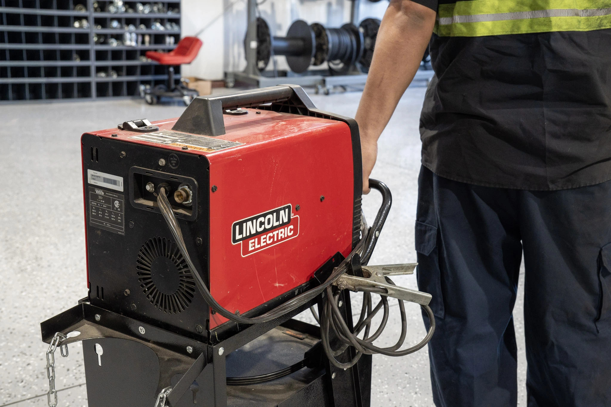 Technician performing preventive maintenance on hydraulic system